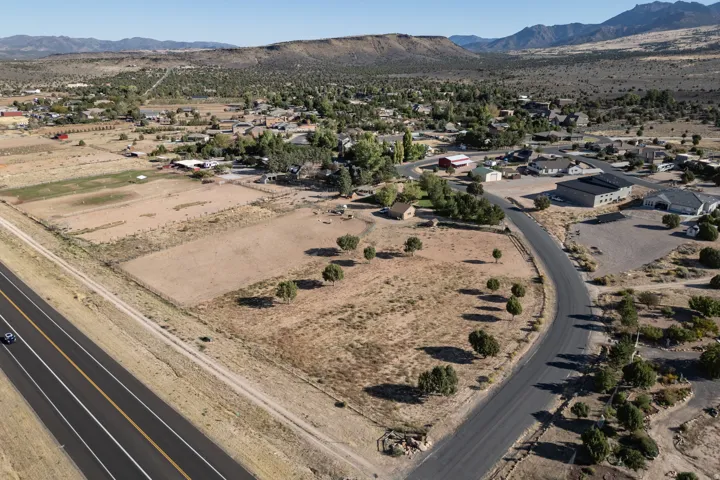 View of property location with a mountain backdrop and nearby suburban area