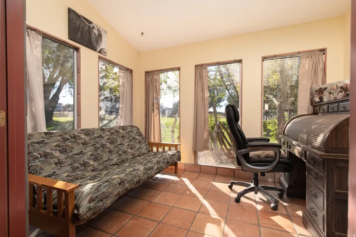 Home office featuring vaulted ceiling and tile patterned floors