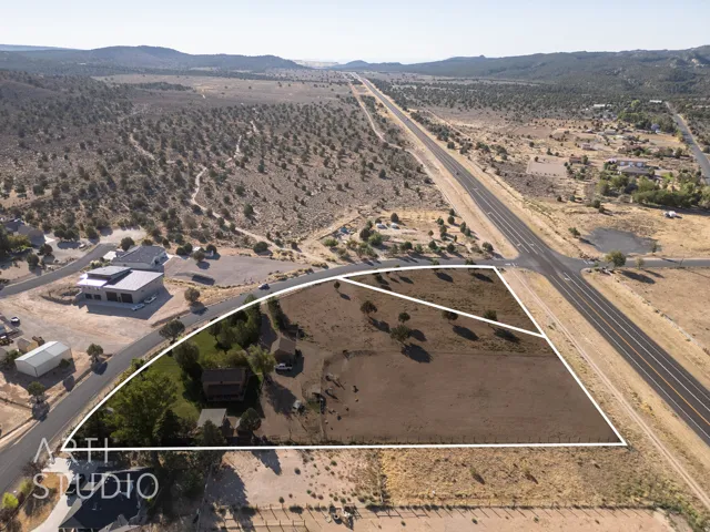 Aerial overview of property's location featuring rural landscape and property parcel outlined
