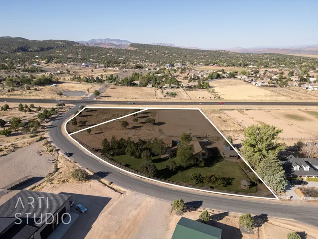 View of property location featuring property parcel outlined and nearby suburban area