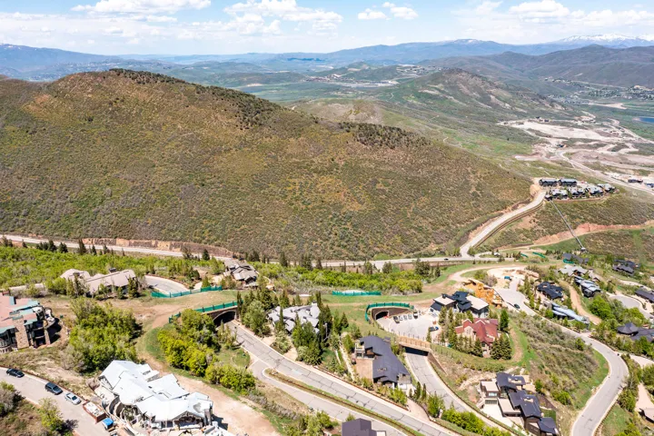 Sloped terrain with established residences featuring varied architectural styles