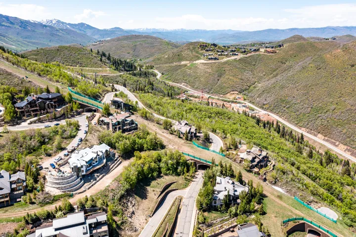 Mountainous landscape featuring multiple luxury residences and winding roadways