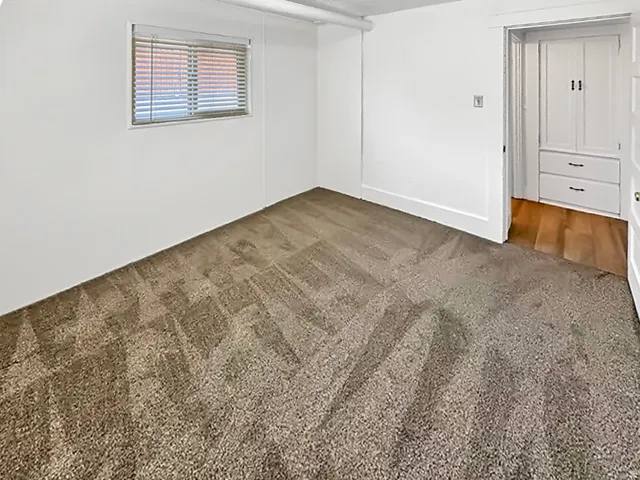 Unfurnished room with carpet flooring