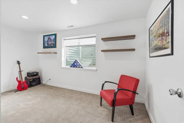 Sitting room featuring carpet flooring and recessed lighting