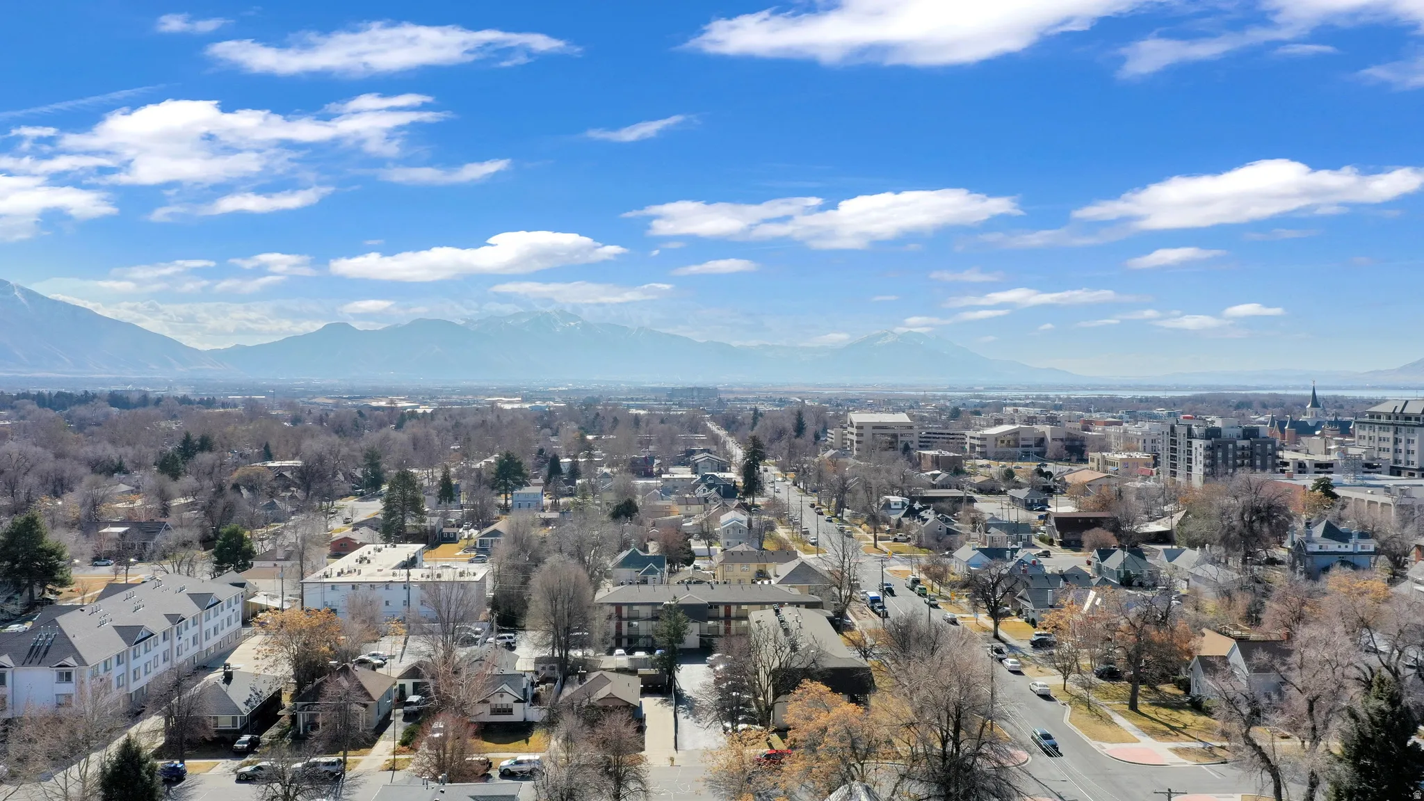 Aerial perspective of suburban area with a mountain backdrop