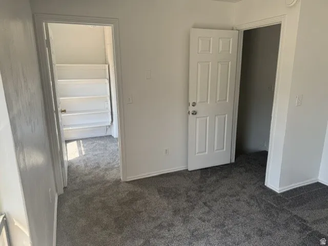 Plush gray carpeting throughout the room
