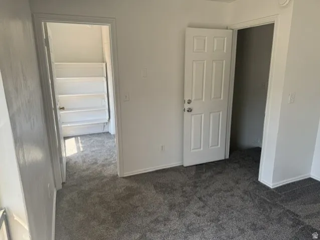 Plush gray carpeting throughout the room