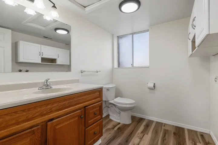 Bathroom with vanity and light wood finished floors