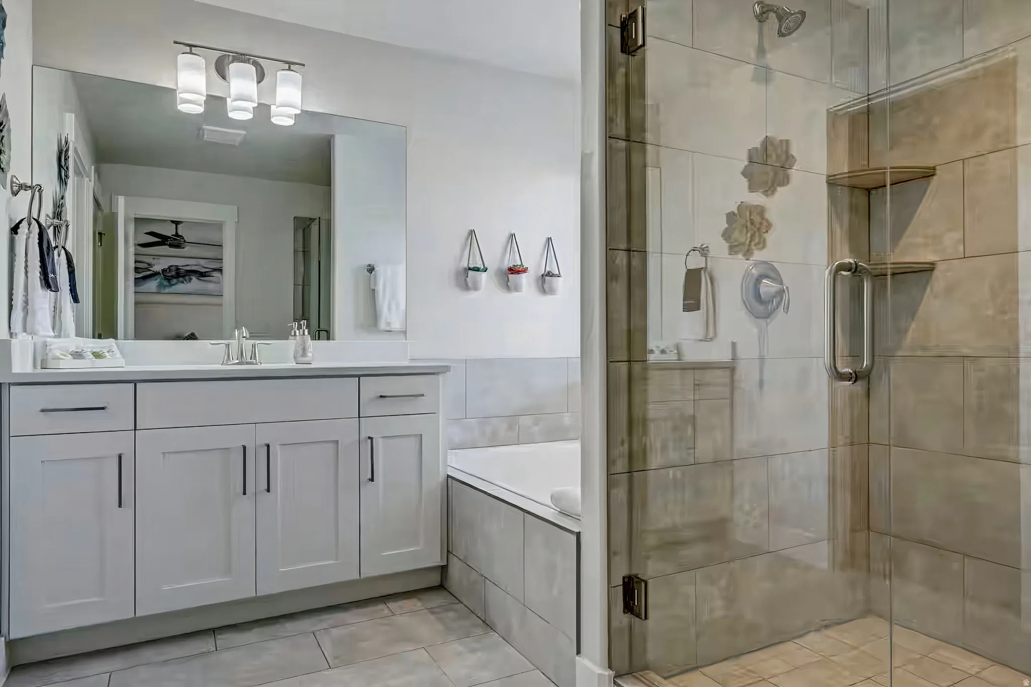 Full bath with a garden tub, a stall shower, vanity, and light tile patterned flooring