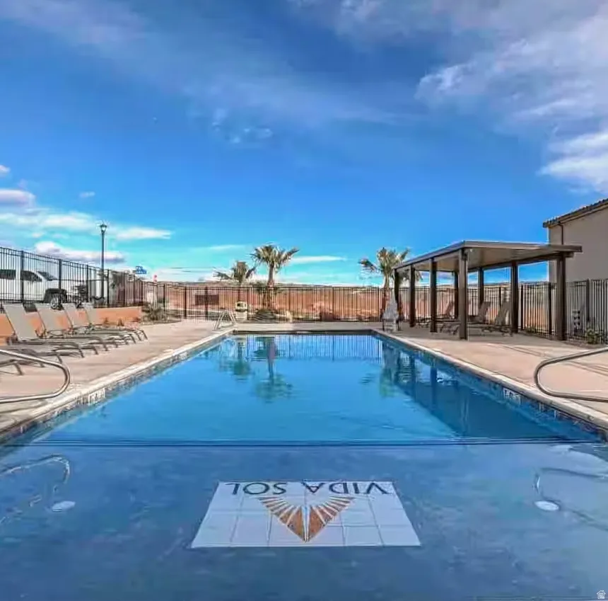 Community pool featuring a patio