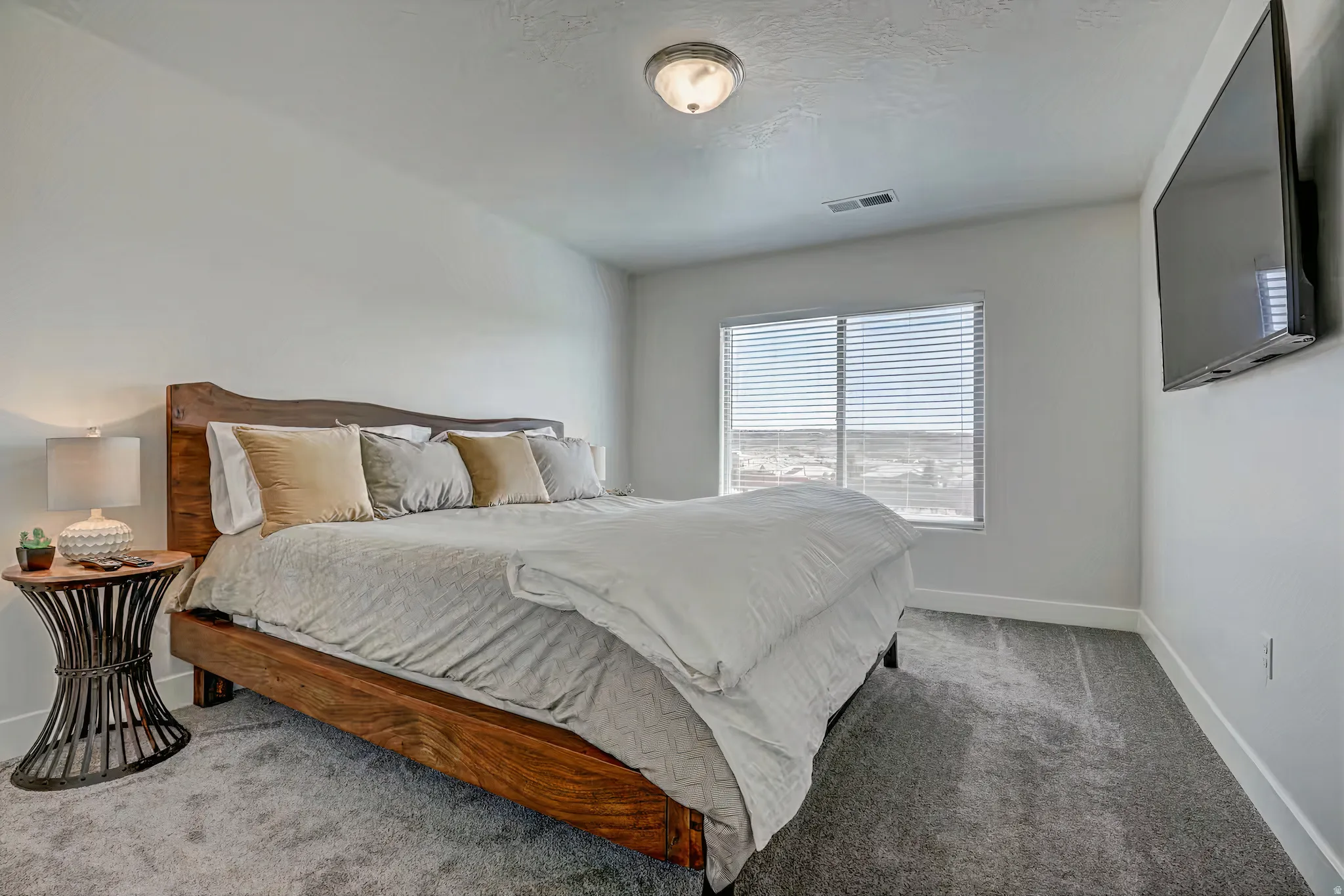 Bedroom featuring baseboards and carpet flooring