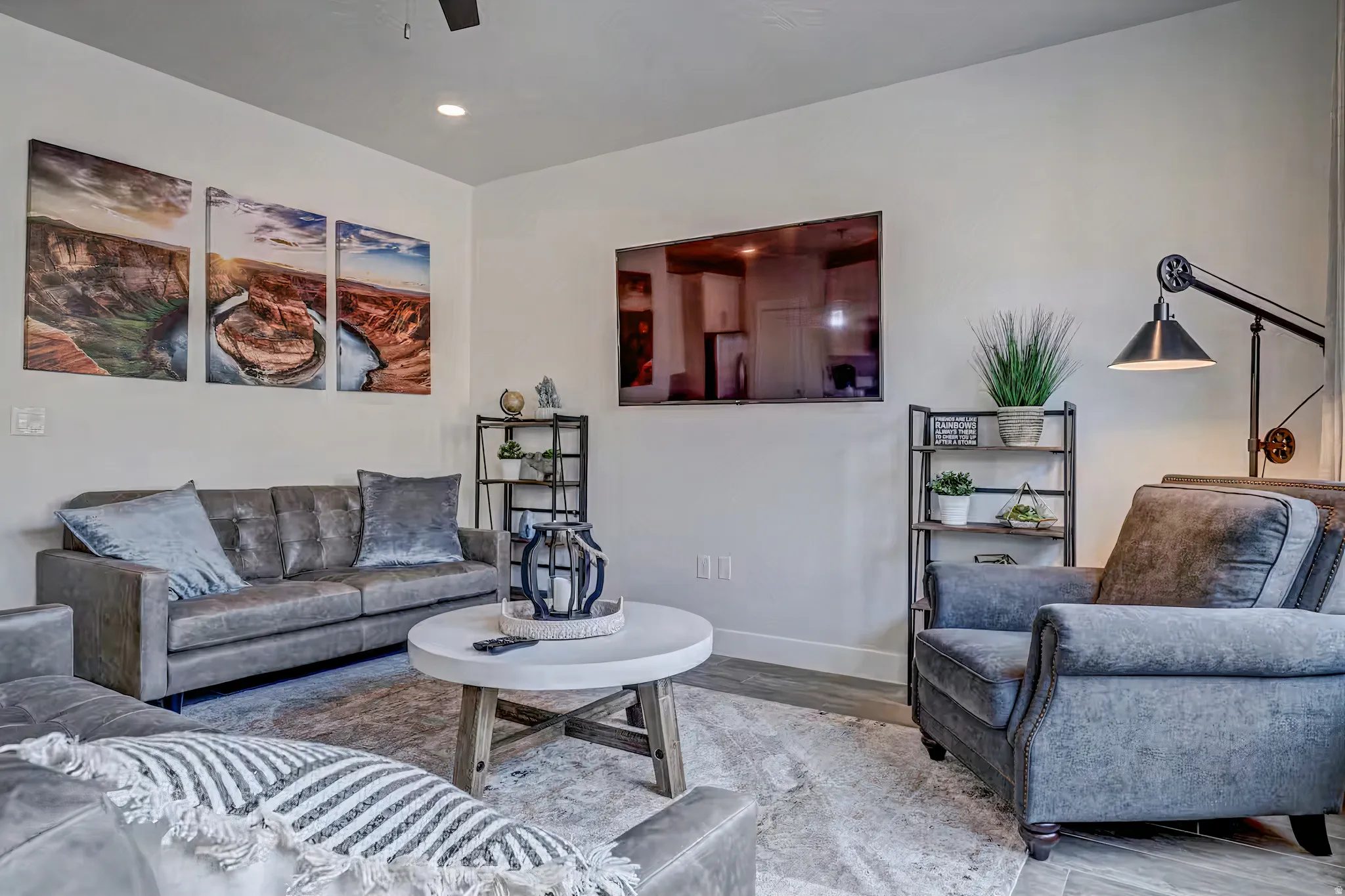 Living room featuring wood finished floors, recessed lighting, and a ceiling fan
