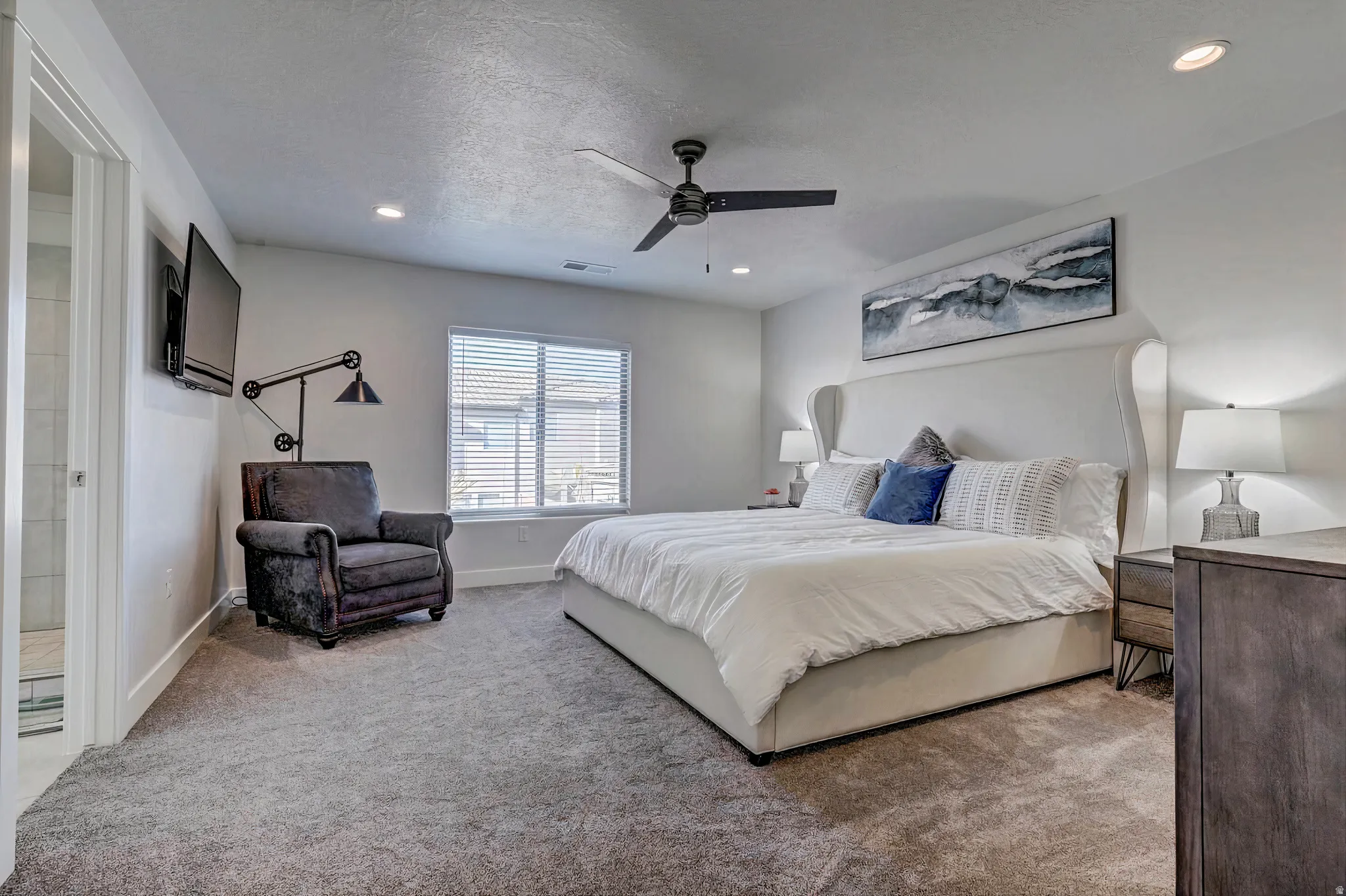 Bedroom featuring a ceiling fan, carpet floors, recessed lighting, and a textured ceiling