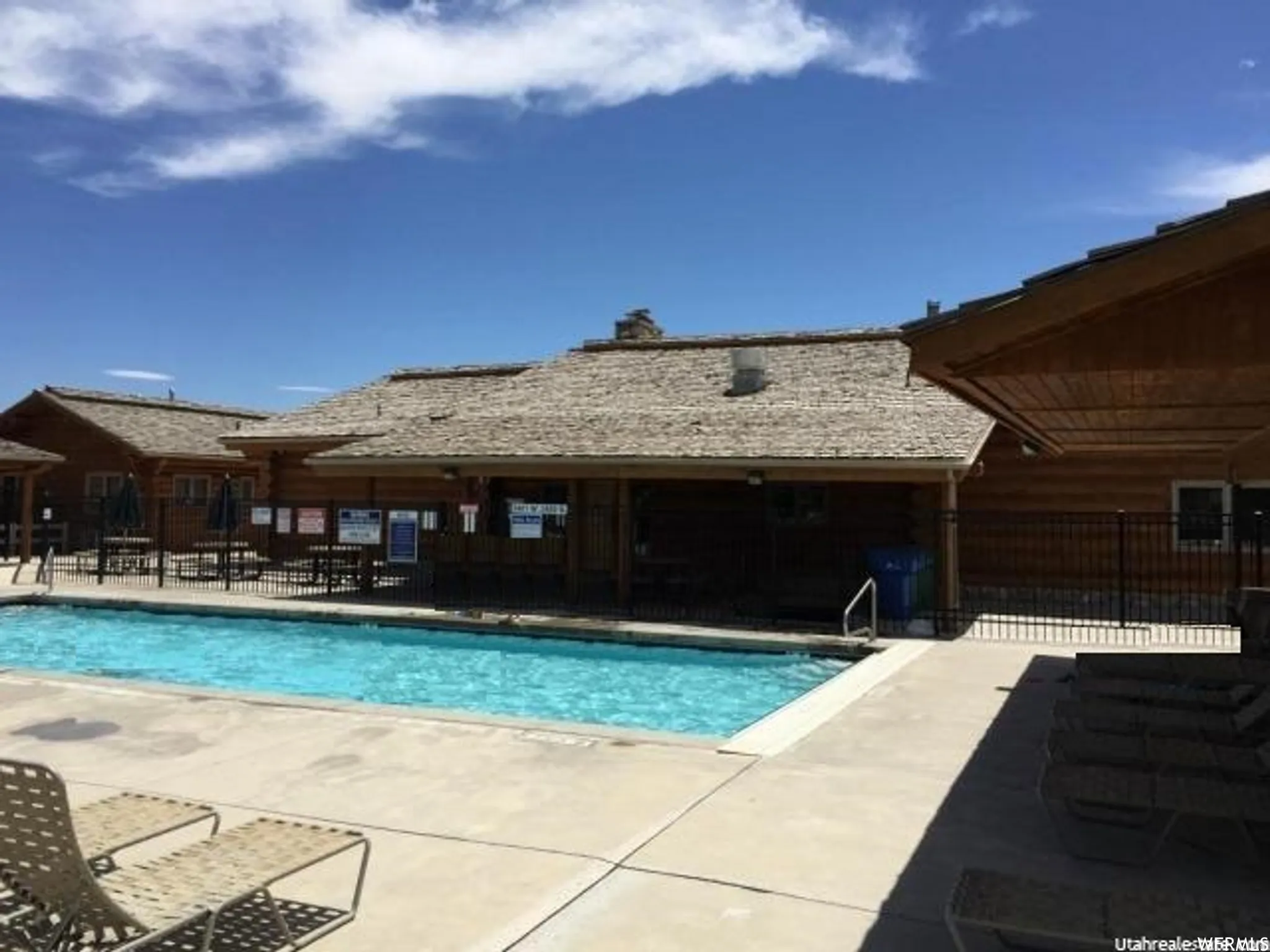 Community pool featuring a patio