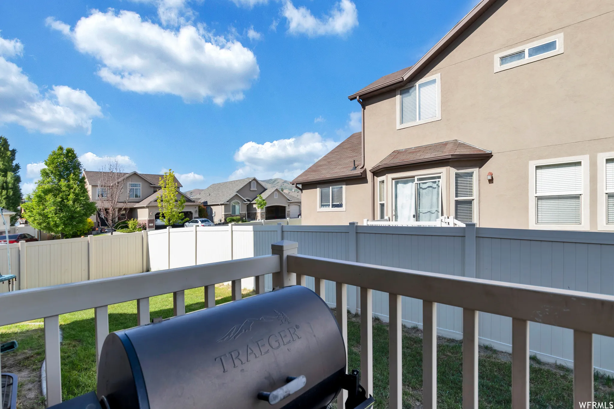 Balcony featuring a residential view and a grill