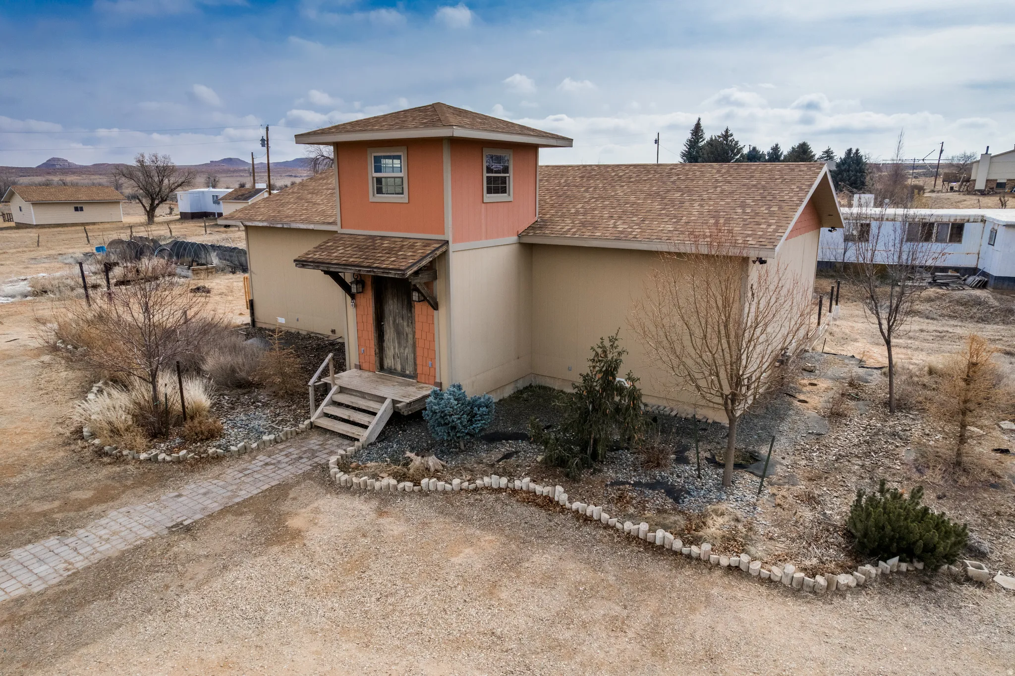 View of front of house with roof with shingles and a mountain view