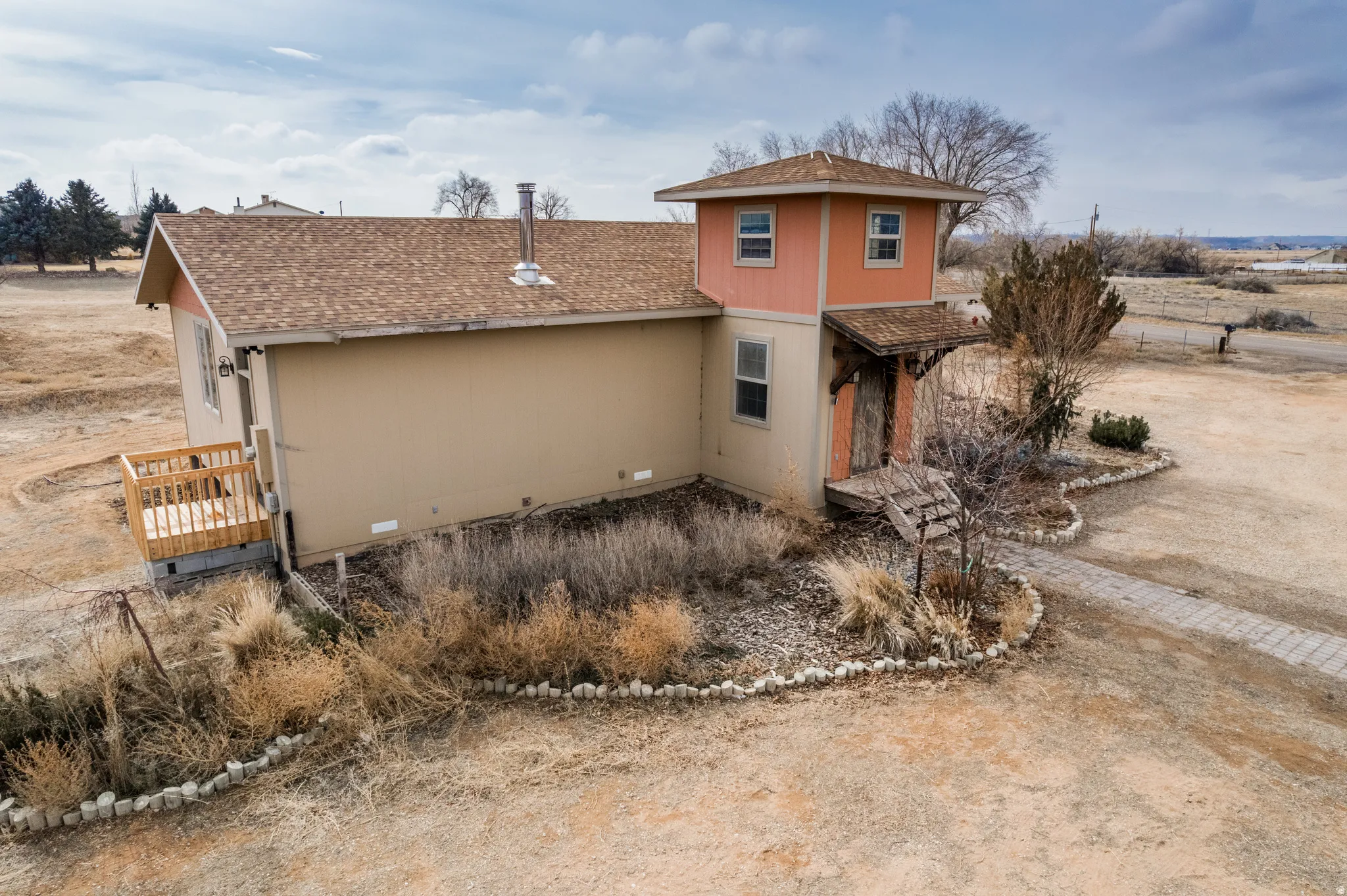 View of front facade featuring roof with shingles