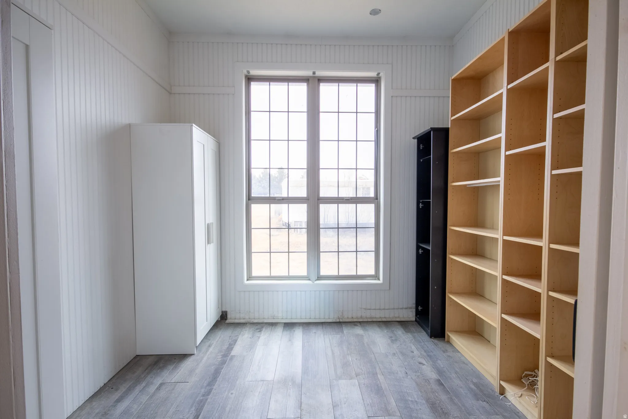 Unfurnished room with light wood-style flooring