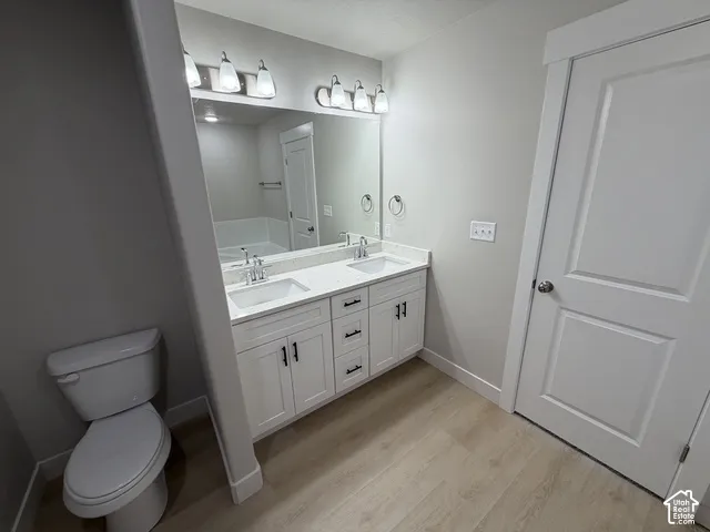Dual vanity with white cabinetry and black hardware