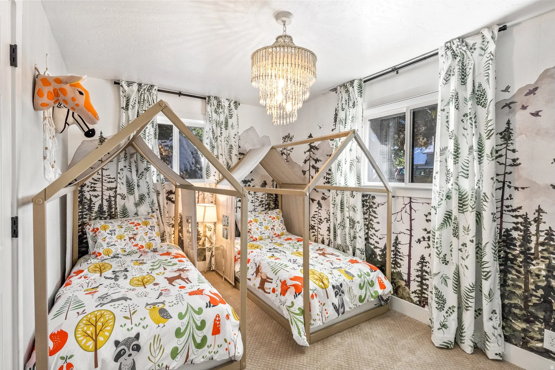 Bedroom featuring carpet floors and hanging lights