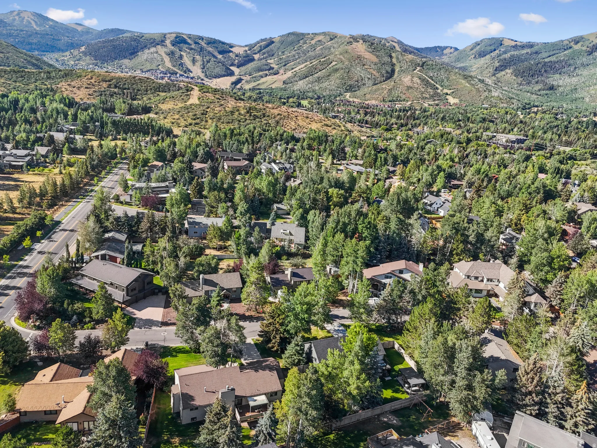 Aerial view of property's location with nearby suburban area