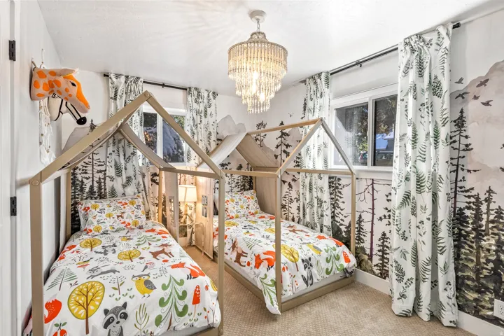 Bedroom featuring carpet floors and hanging lights