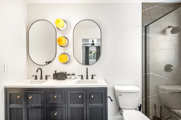 Bathroom with double vanity and a shower