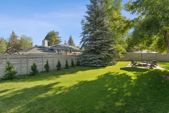 Fenced backyard with a patio