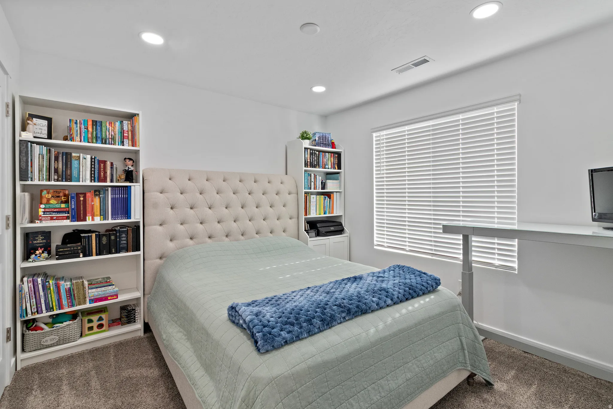 Bedroom featuring dark carpet and recessed lighting