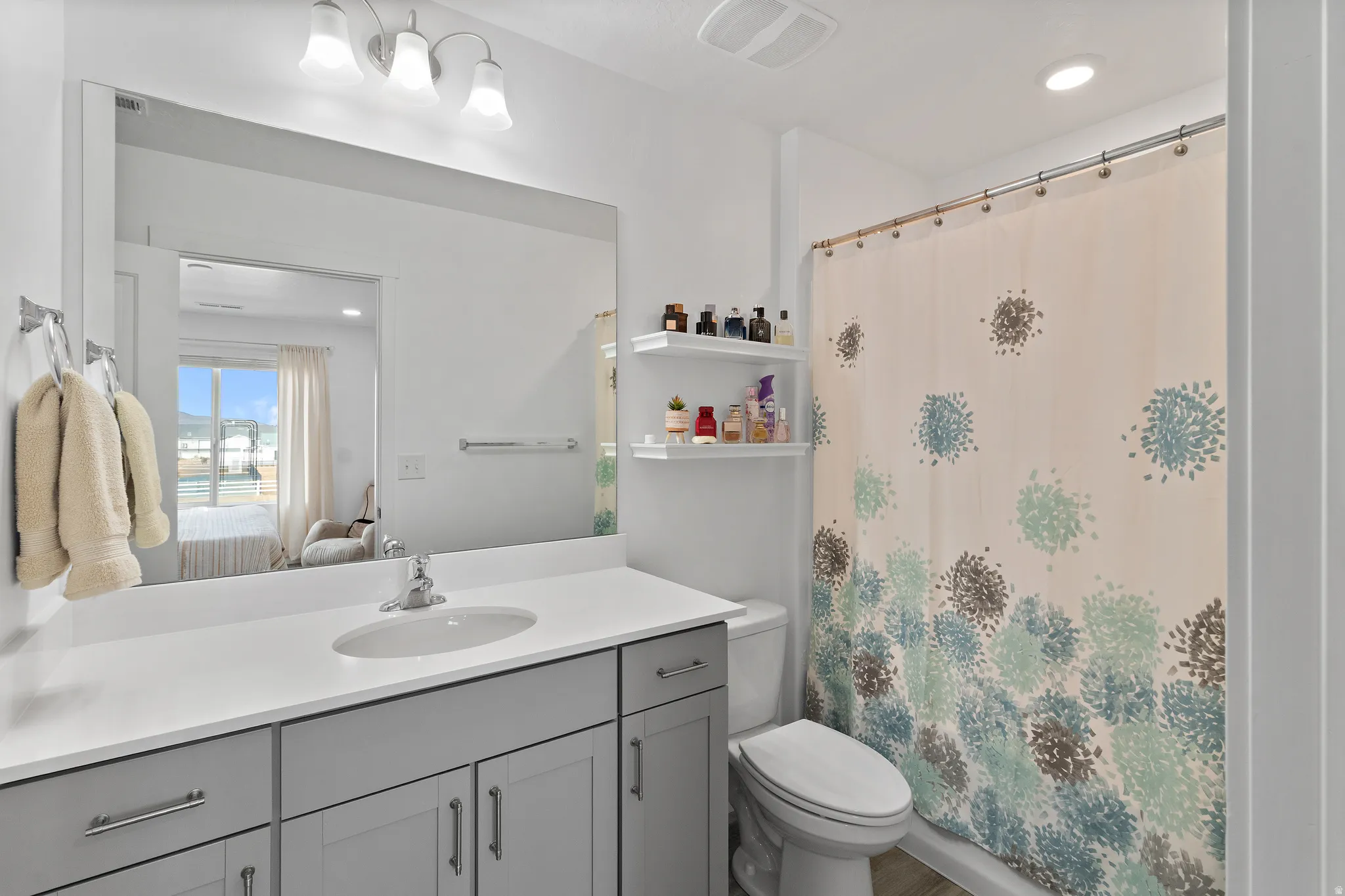 Ensuite bathroom featuring vanity and recessed lighting