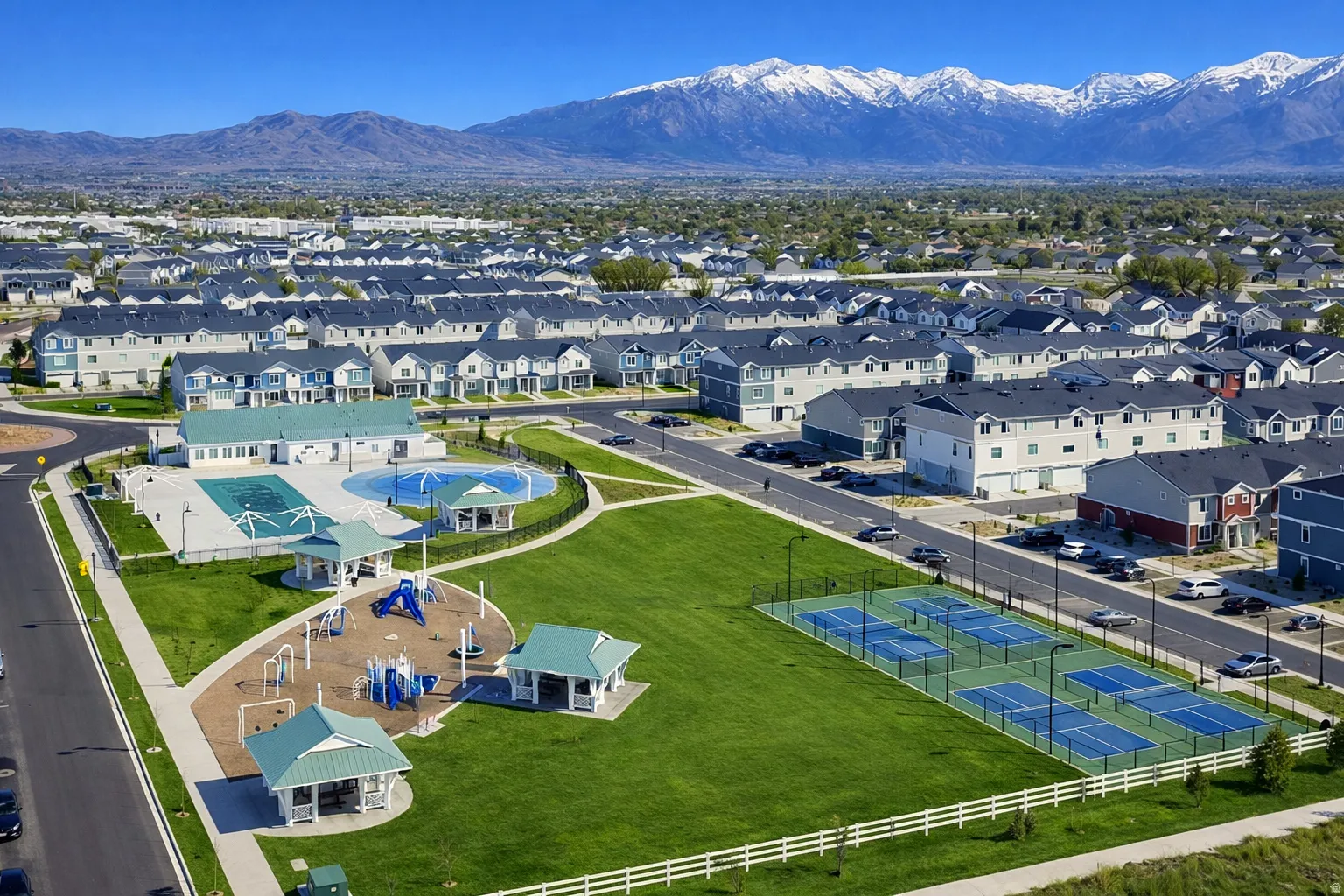 Aerial view of residential area featuring a mountain backdrop