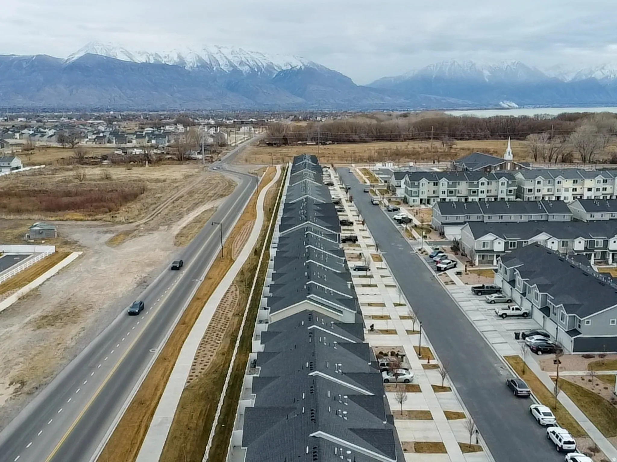 Aerial view of residential area with a mountainous background