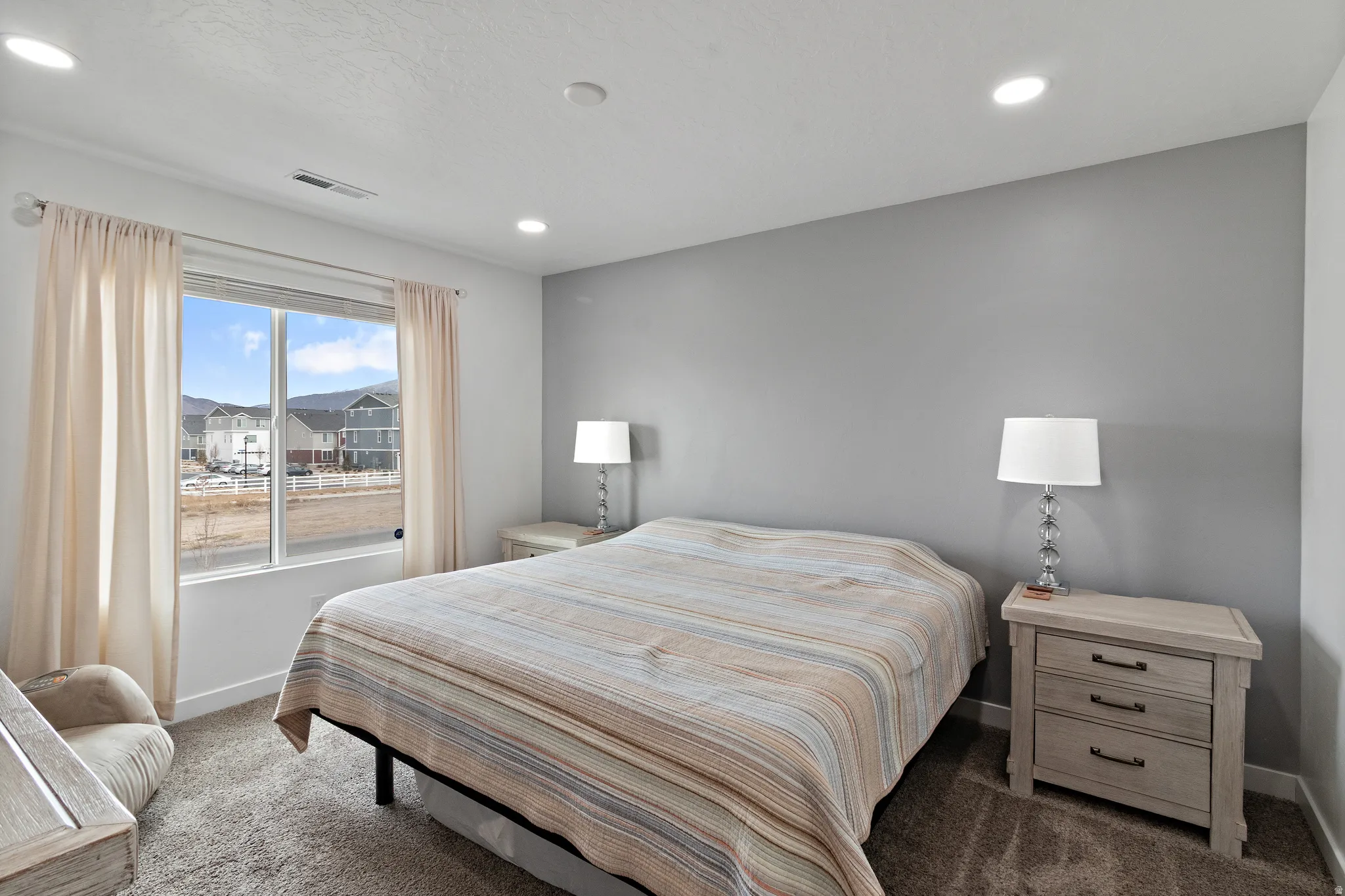 Carpeted bedroom featuring baseboards and recessed lighting