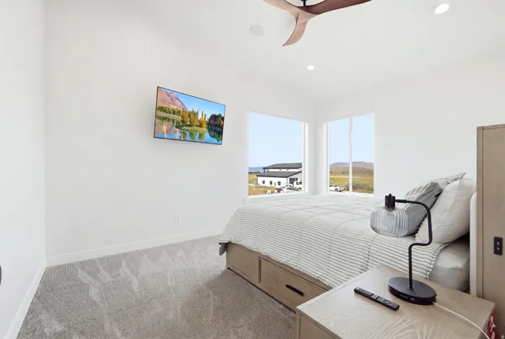 Recessed lighting, ceiling fan, and large windows