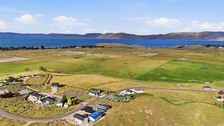 Expansive land with a lake and distant mountains