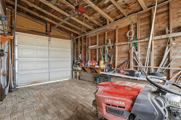 Garage featuring a garage door opener