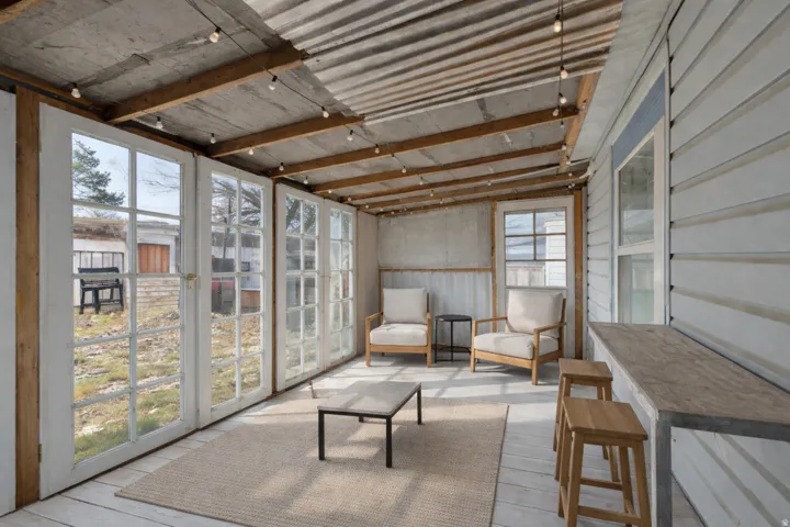 Sunroom / solarium featuring french doors
