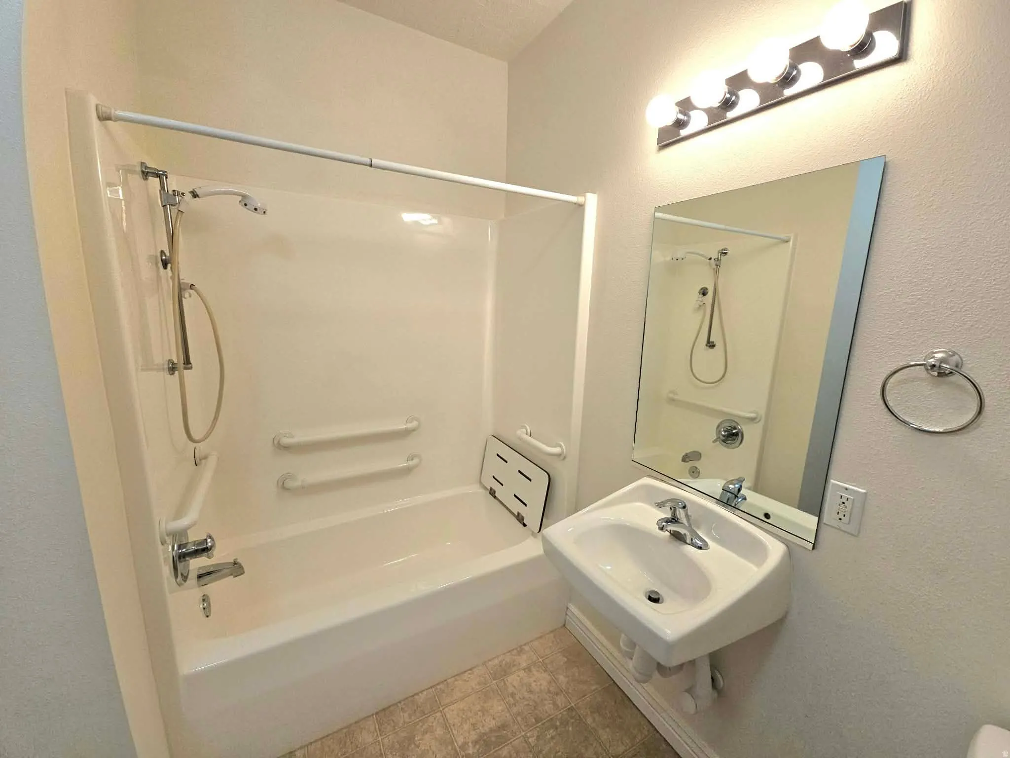 Full bathroom with tub and shower combo