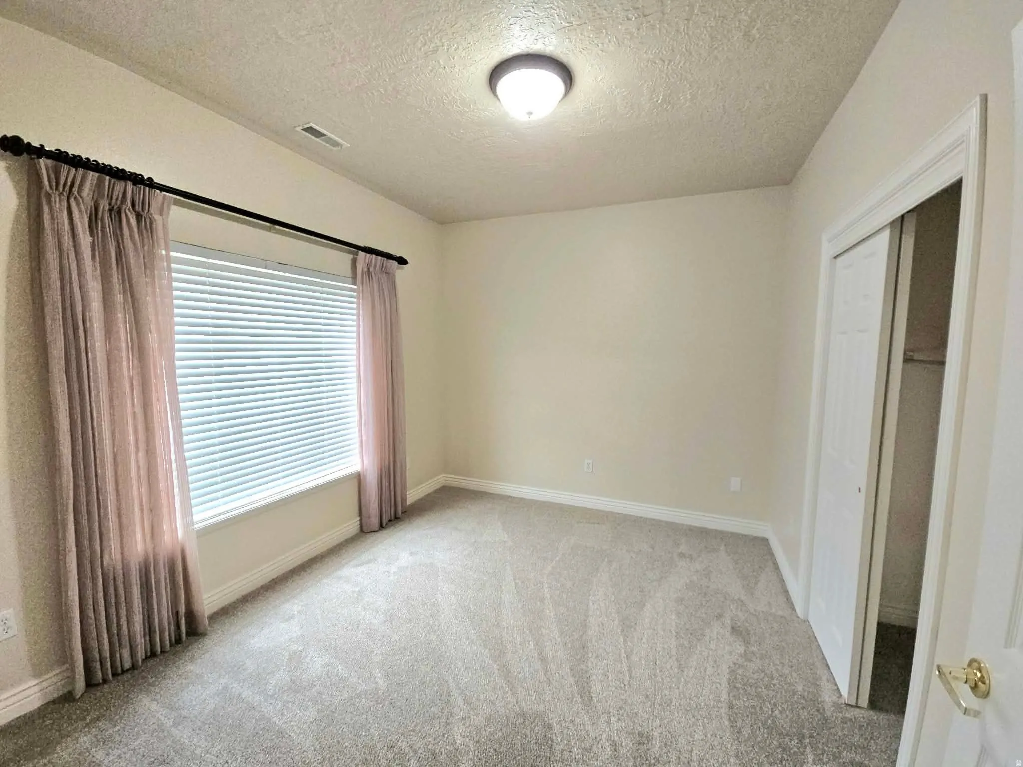 Bedroom with a beautiful view and new carpet