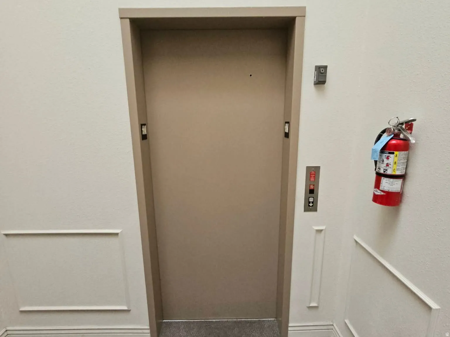 The elevator is right down the hallway that leads to the garage and storage level