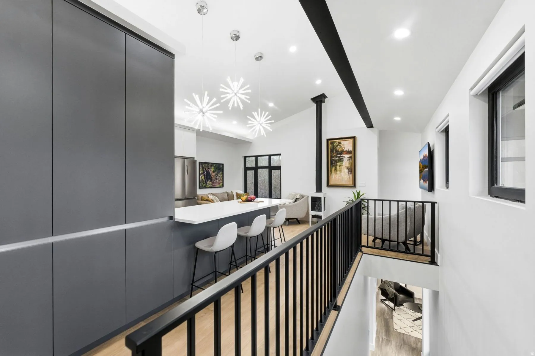 Corridor featuring lofted ceiling with beams, an upstairs landing, and recessed lighting