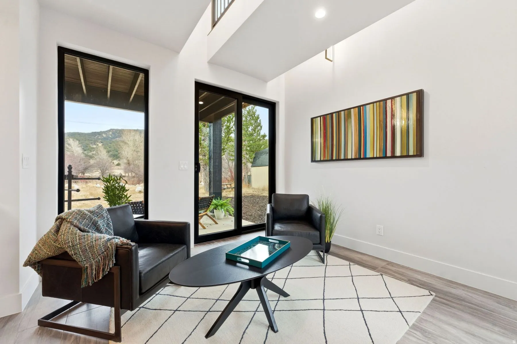 Living area featuring light wood-style floors and a mountain view