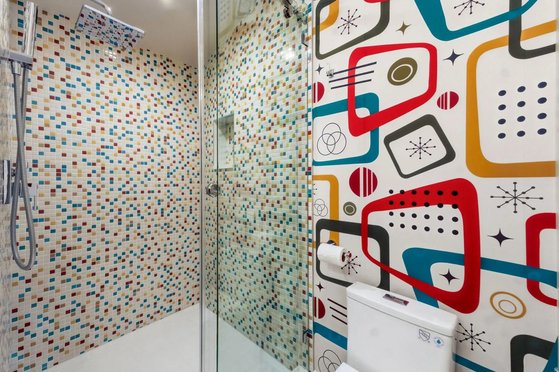 Bathroom featuring a shower stall and toilet