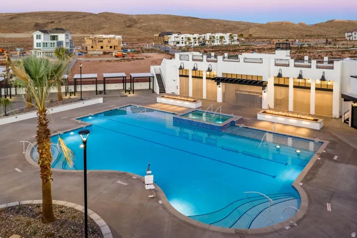 Relaxing pool / spa with a patio area and a mountain view