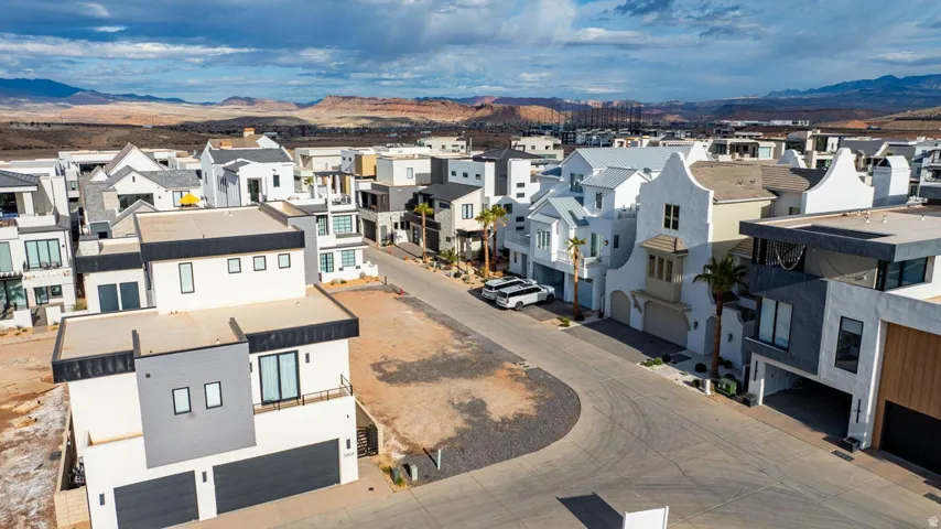 Aerial perspective of suburban area with a mountain backdrop
