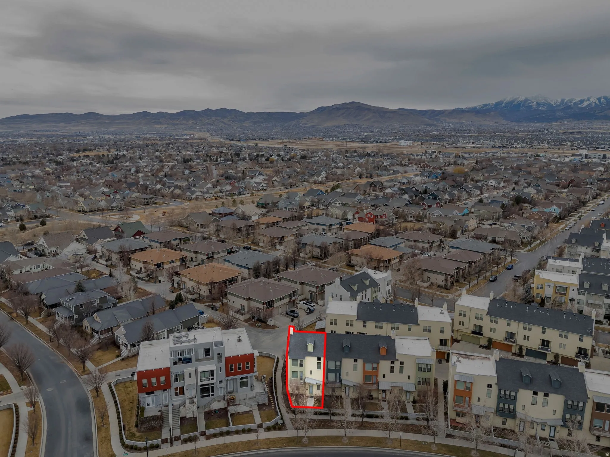 Aerial view of residential area with a mountain backdrop