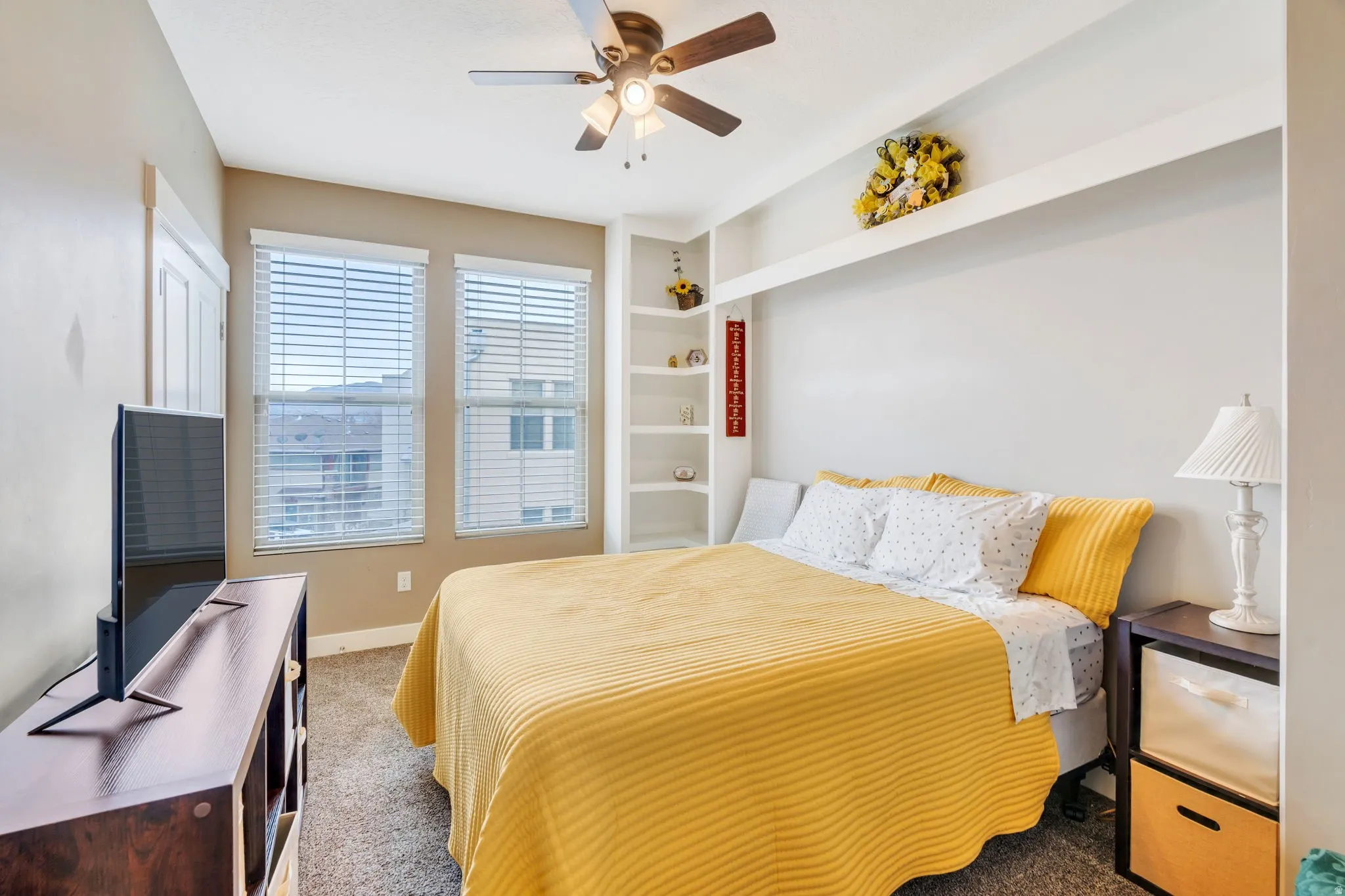 Bedroom with carpet floors and ceiling fan