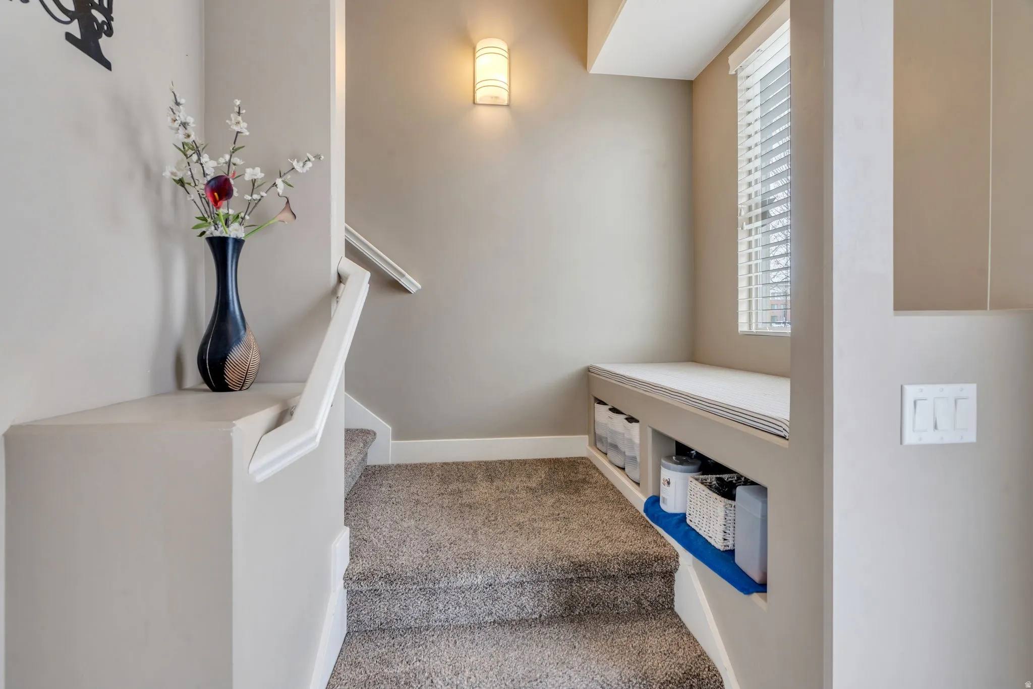 Stairway featuring carpet flooring and baseboards