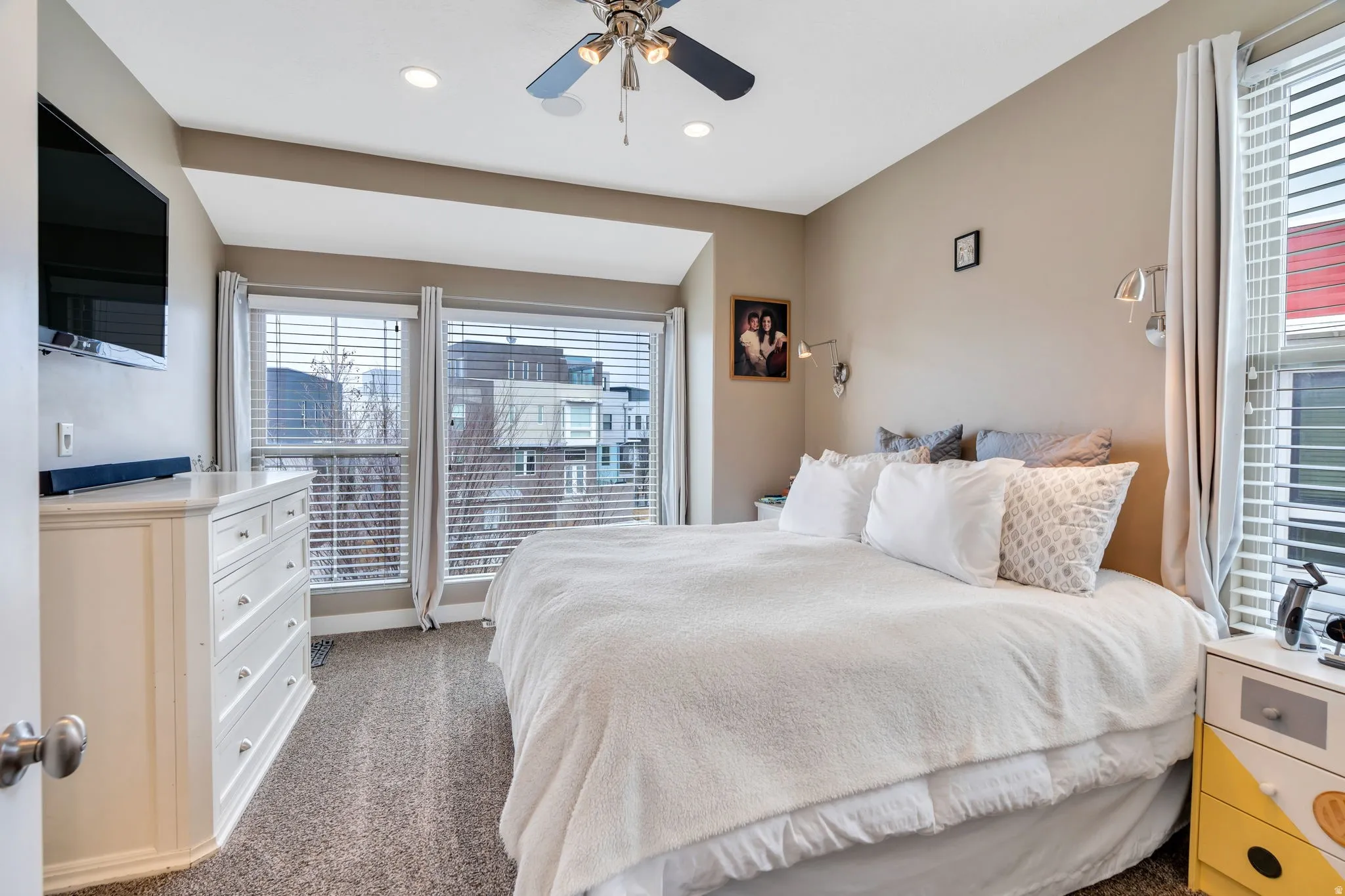 Bedroom with carpet flooring, ceiling fan, and recessed lighting