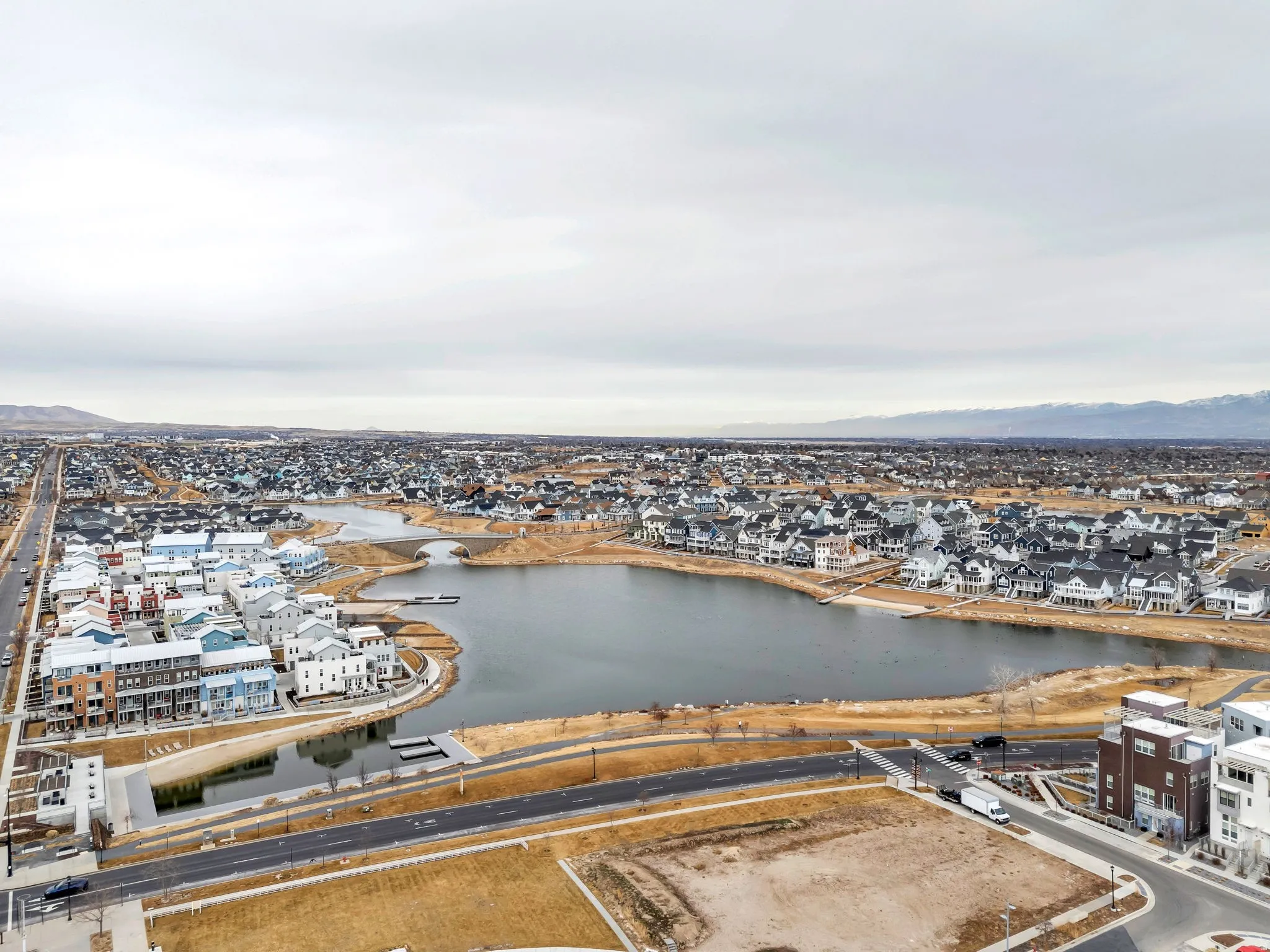 Aerial view of residential area featuring a large body of water